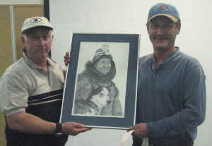 Joee presents print to raffle winner