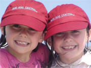 Jamie & Gracie Ramsay, with their Sled Dog Santa caps in Cocoa Beach, Florida